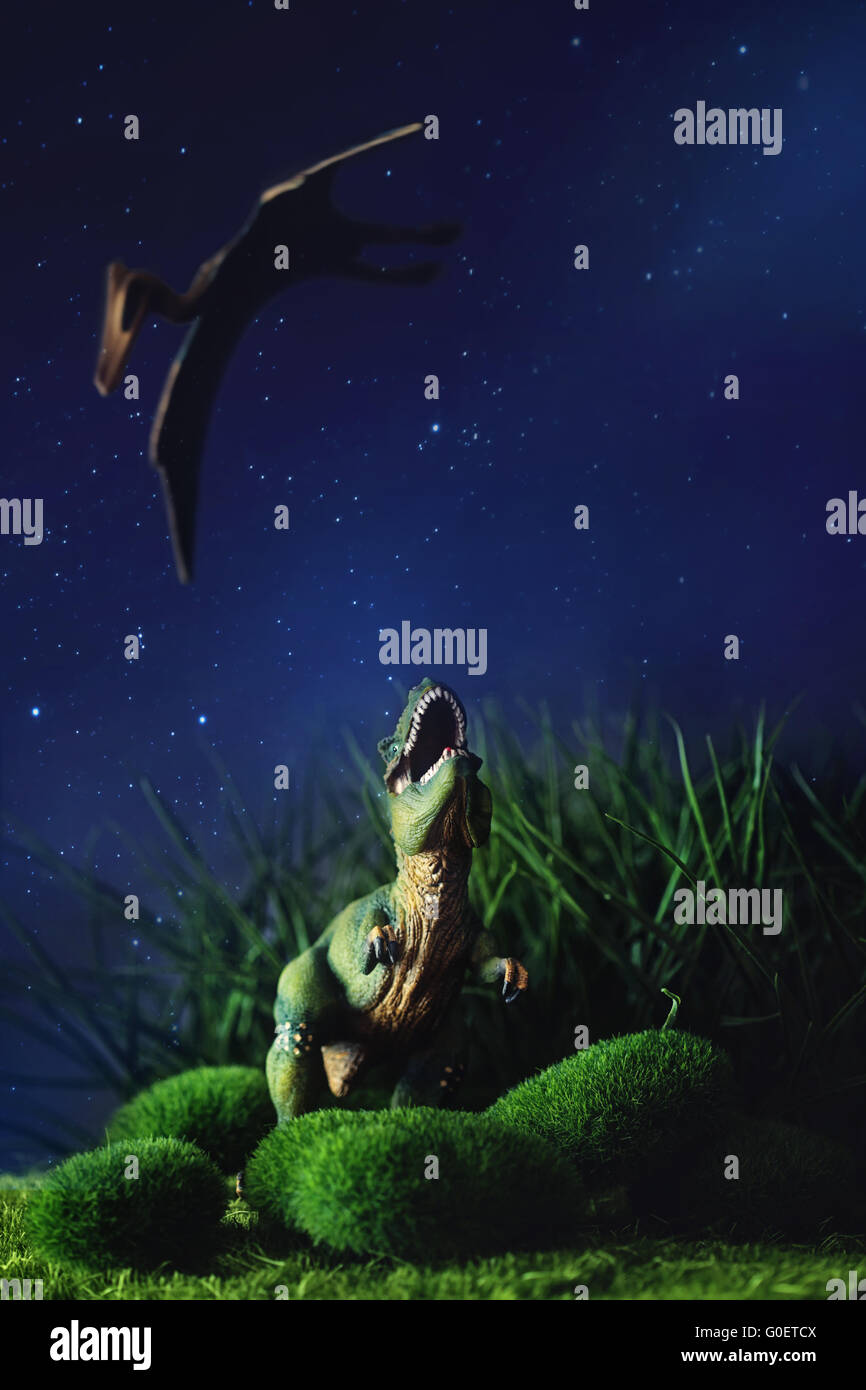 Tyrannosaurus fighting with a prehistoric flying b Stock Photo