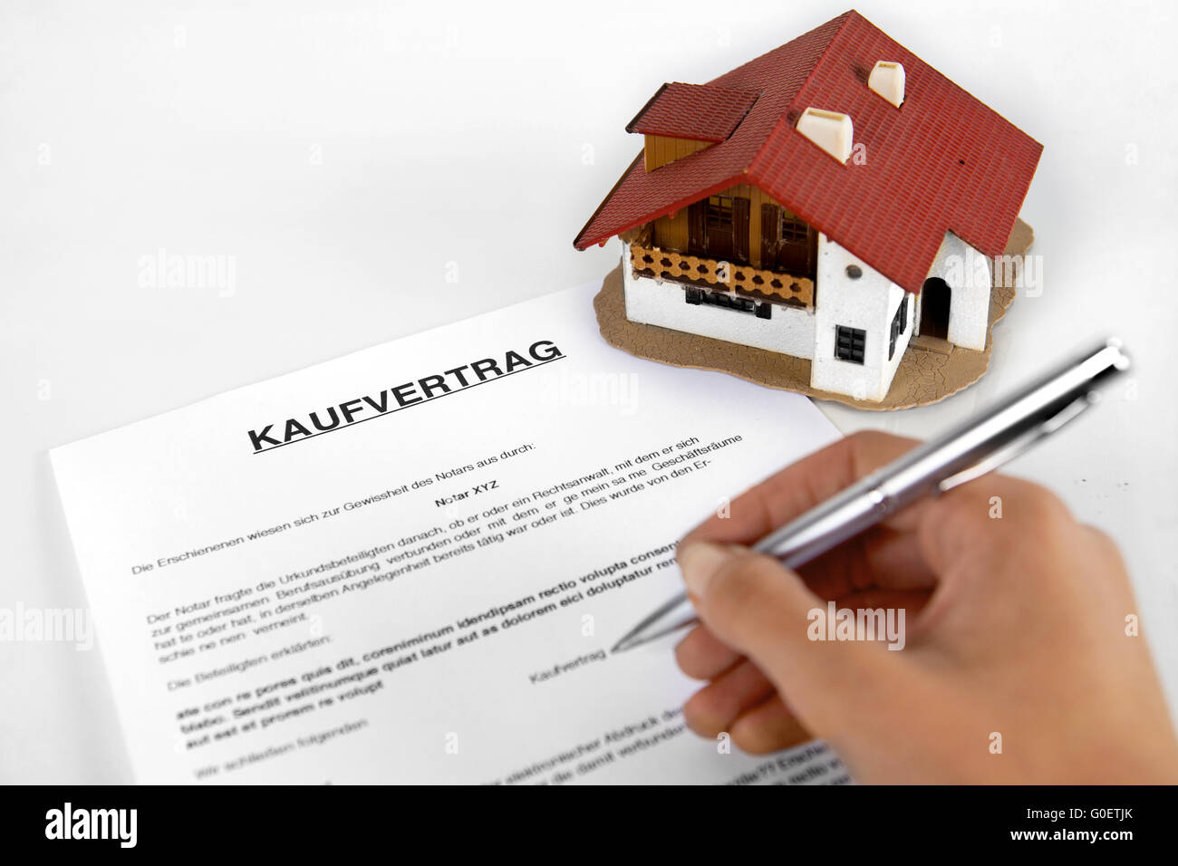 Signing real estate contract - Concept with the Ge Stock Photo