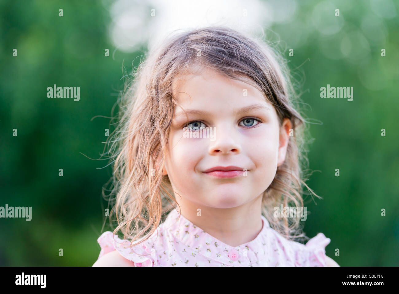 Serious girl. Cute little girl looking at camera Stock Photo - Alamy