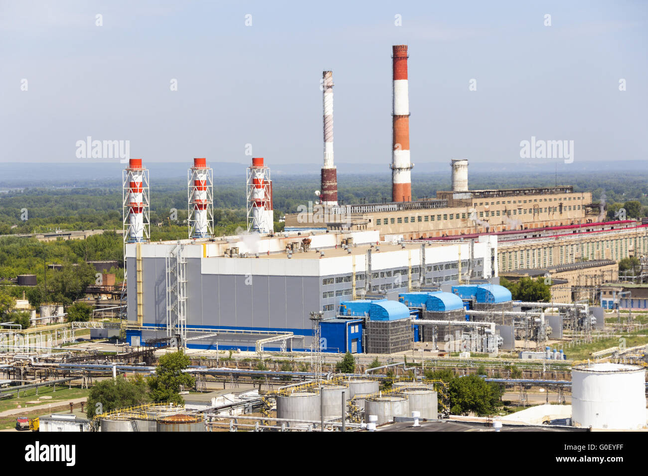 Russian refinery complex through smoke Stock Photo