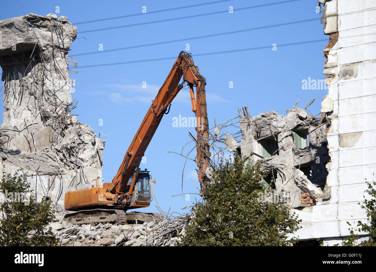 The dredge destroys an old building Stock Photo