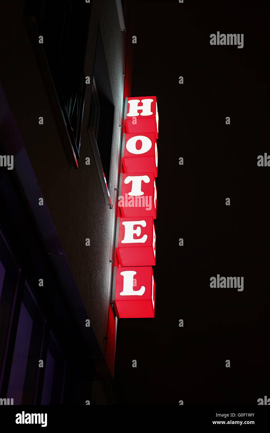 Neon sign of a hotel in Cologne Stock Photo