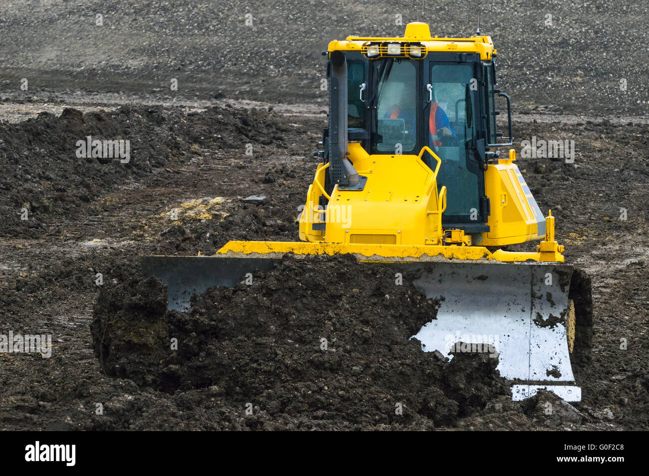 Bulldozer during earthworks at construction site Stock Photo
