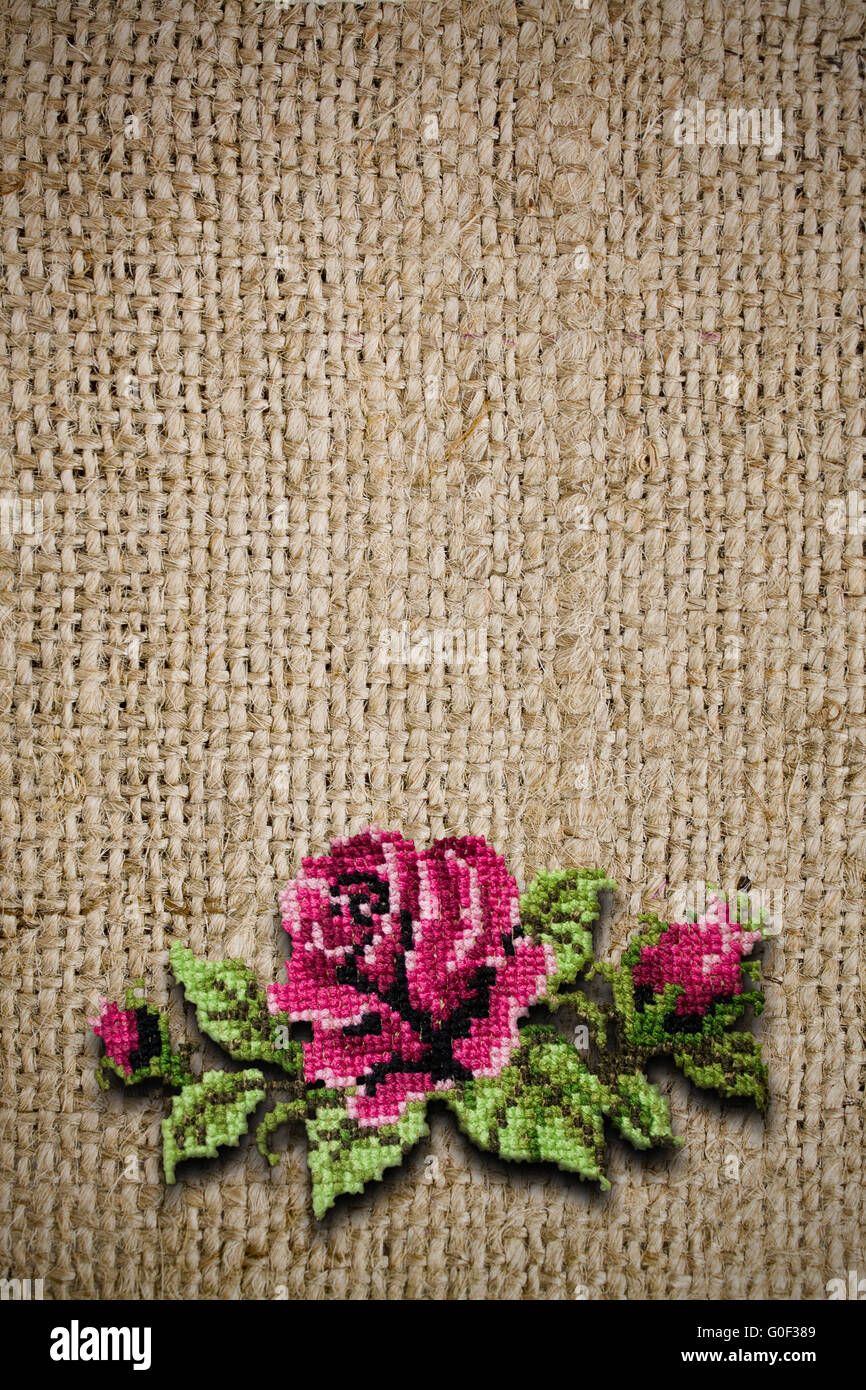 background from fabric with the embroidered rose Stock Photo Alamy