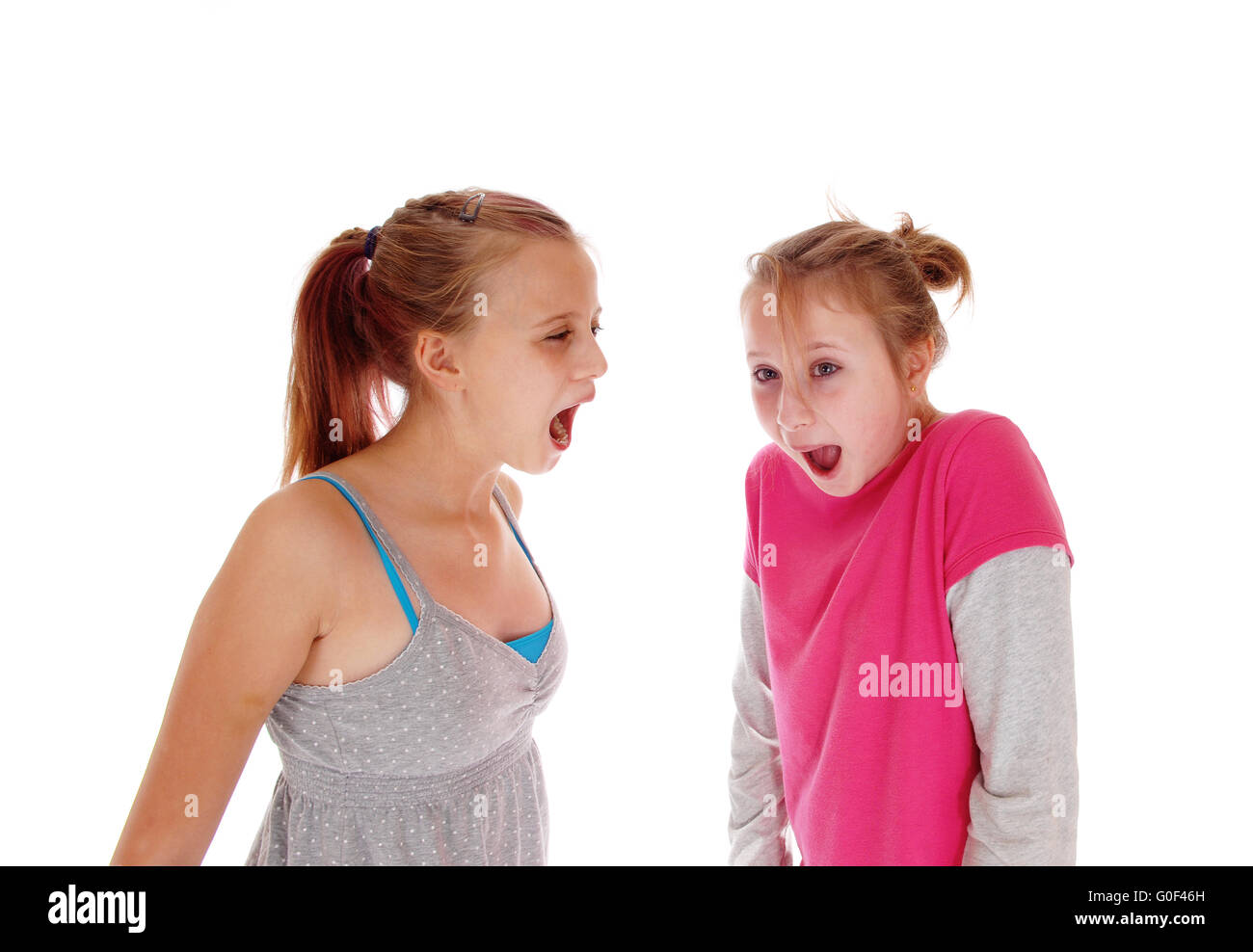 Two sisters screaming at each other. Stock Photo