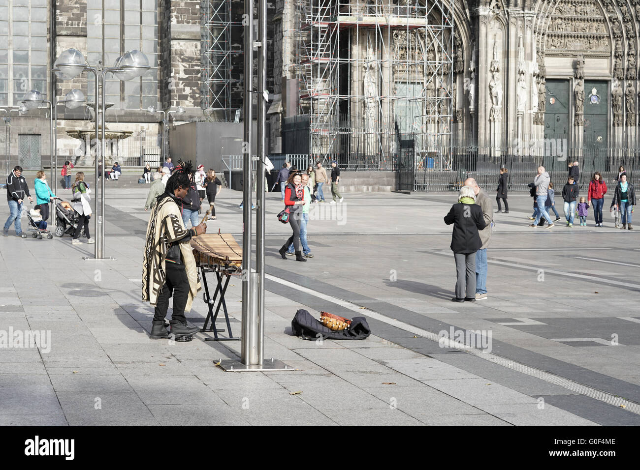 a street musician at the Cologne Cathedral in the center of Cologne Stock Photo
