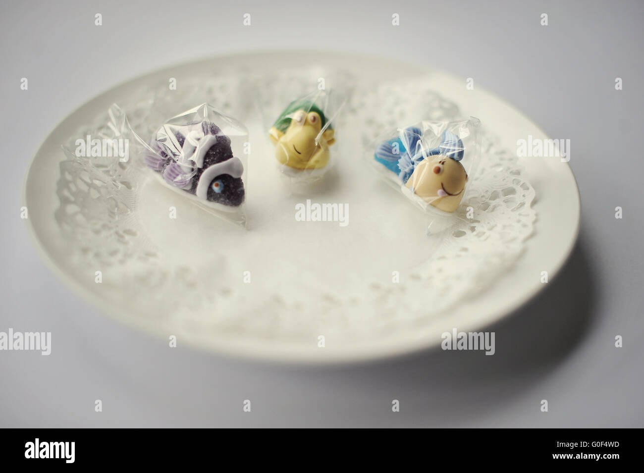 sweet candies of three fish food isolated on white Stock Photo Alamy