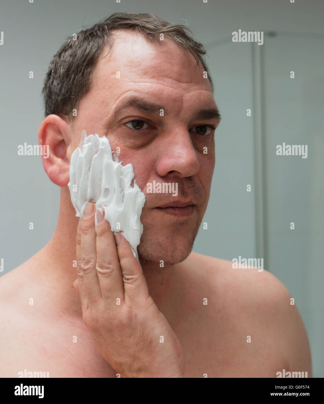 Man shaves the face Stock Photo