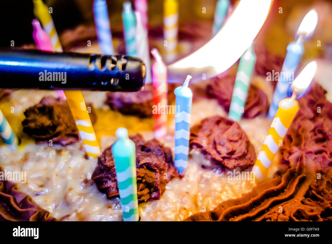lighting Colorful candles on birthday cake Stock Photo Alamy
