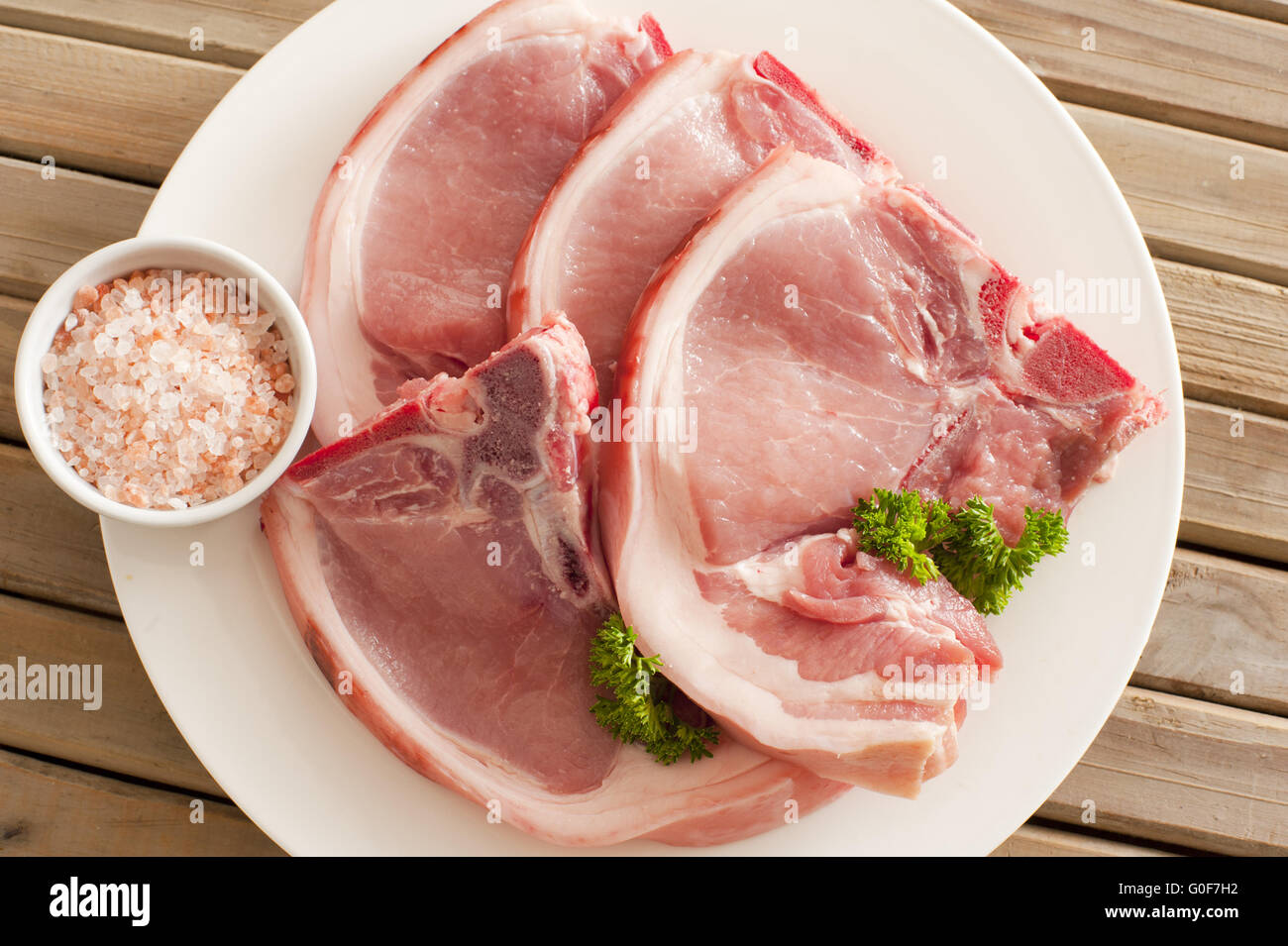 Raw pork cutlets with their rind Stock Photo
