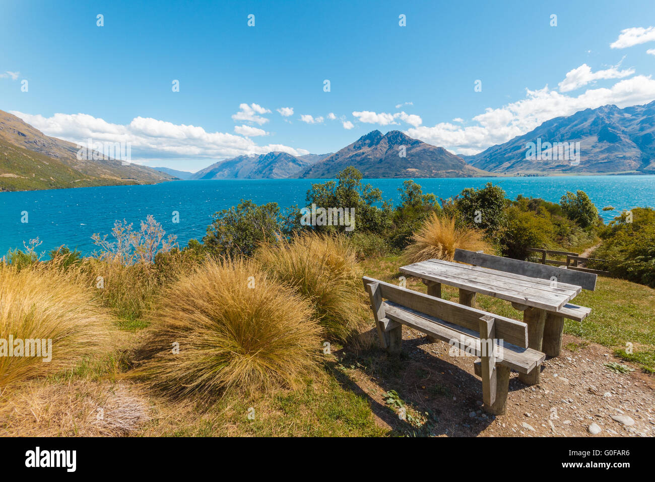 Picnic table at lake near Queenstown, New Zealan Stock Photo - Alamy