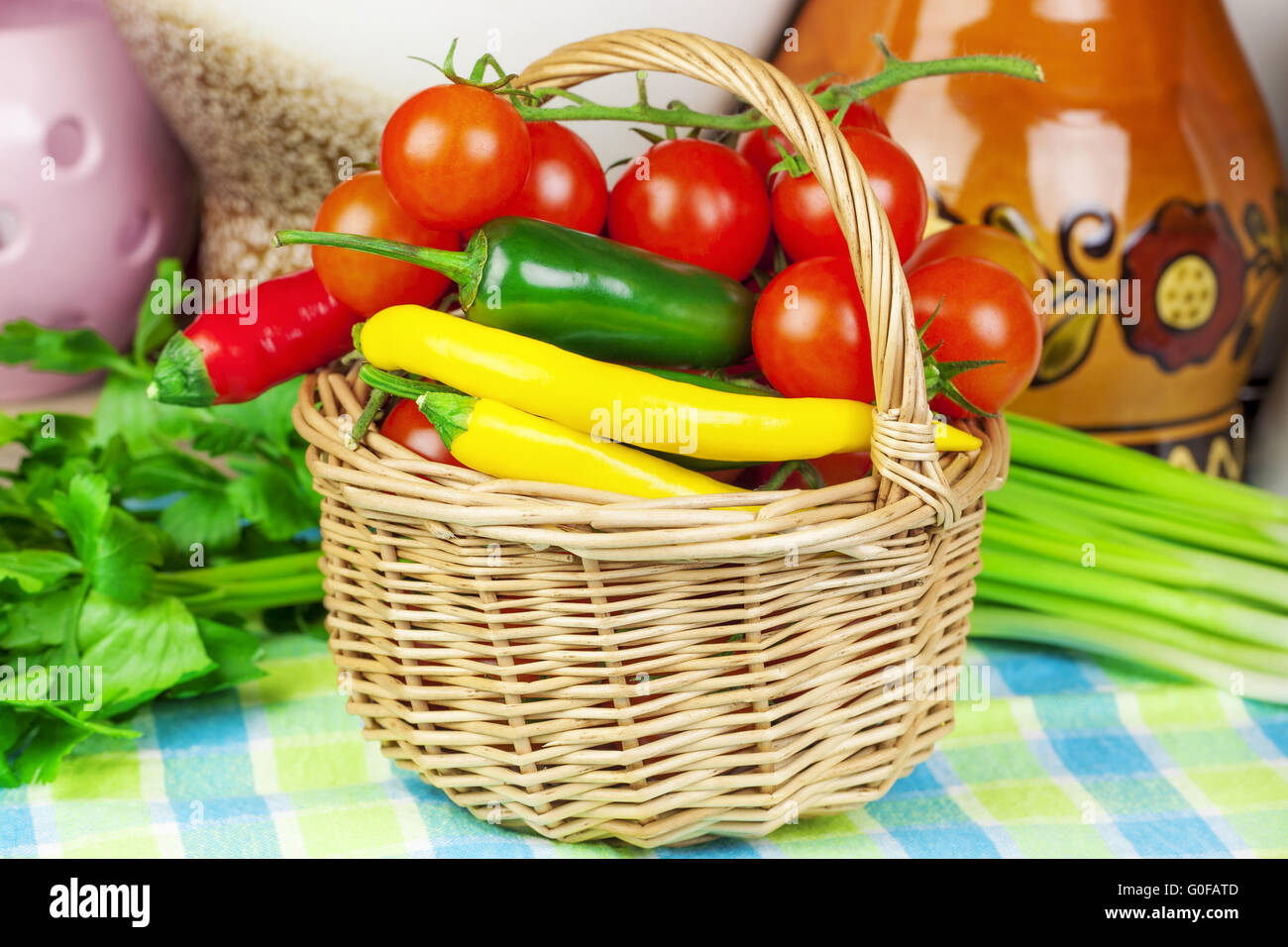 Peppers, tomatoes with spring onions and parsley i Stock Photo