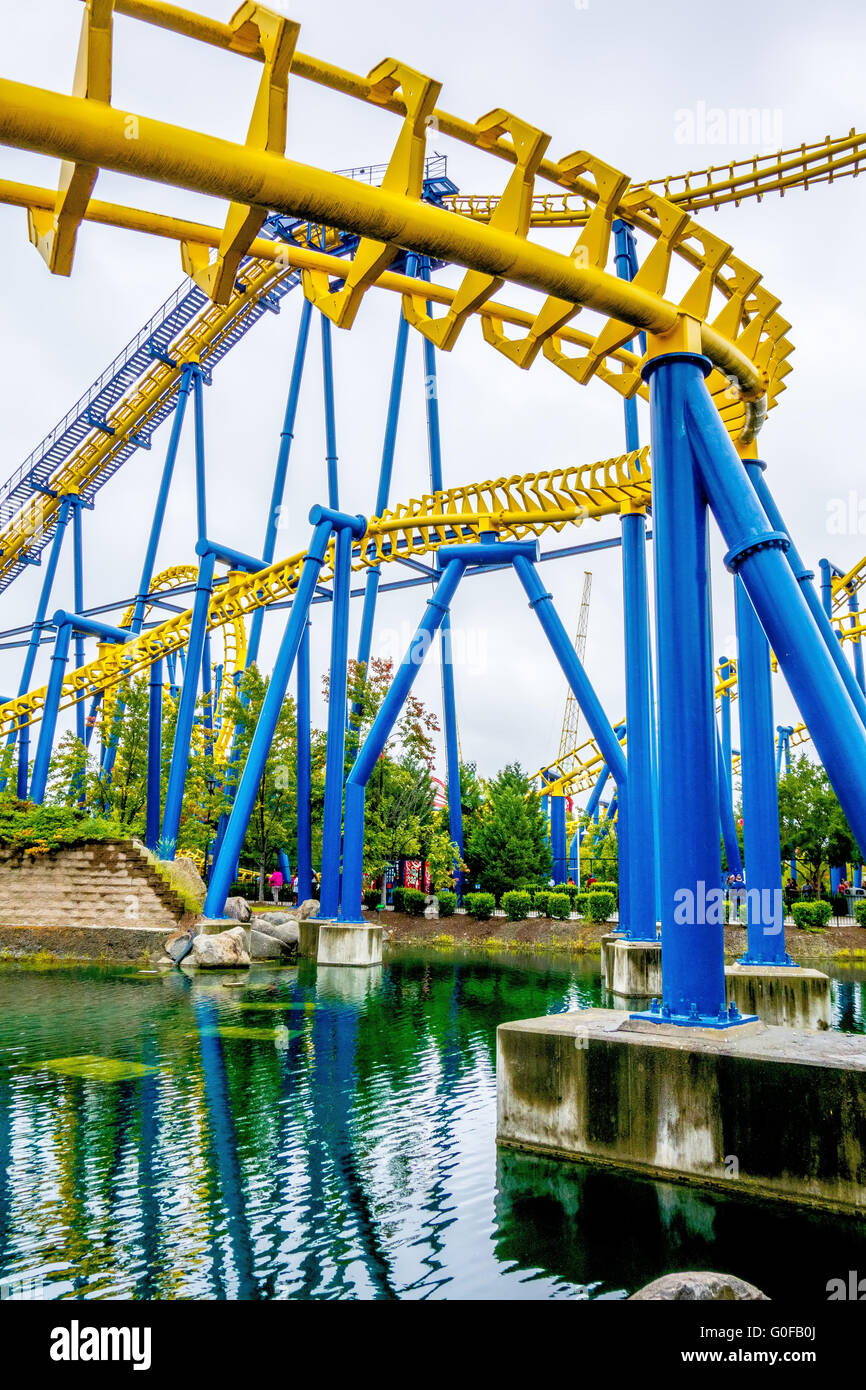 crazy rollercoaster rides at amusement park Stock Photo Alamy
