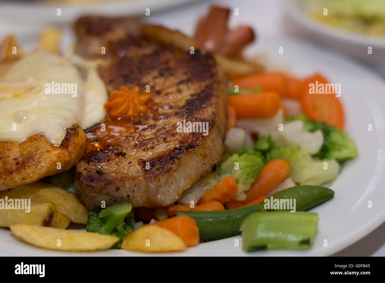tasty pork chop and vegetables Stock Photo