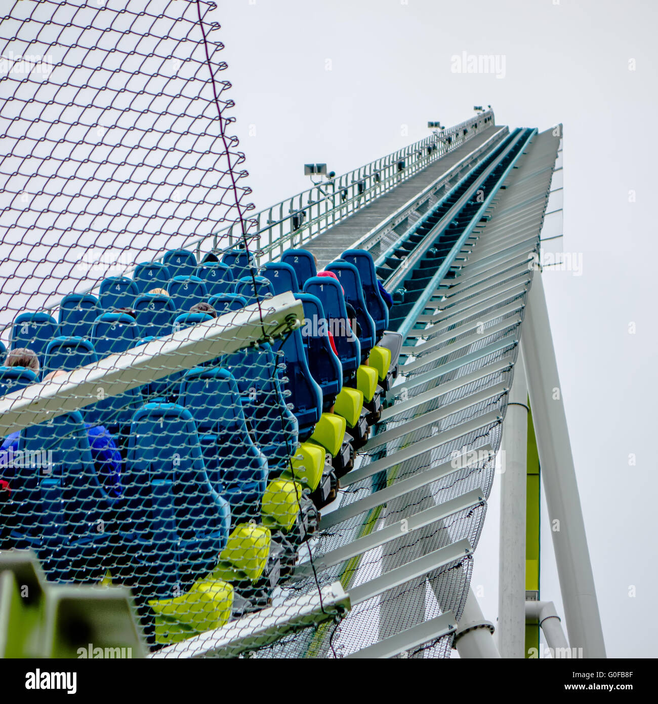 crazy rollercoaster rides at amusement park Stock Photo - Alamy