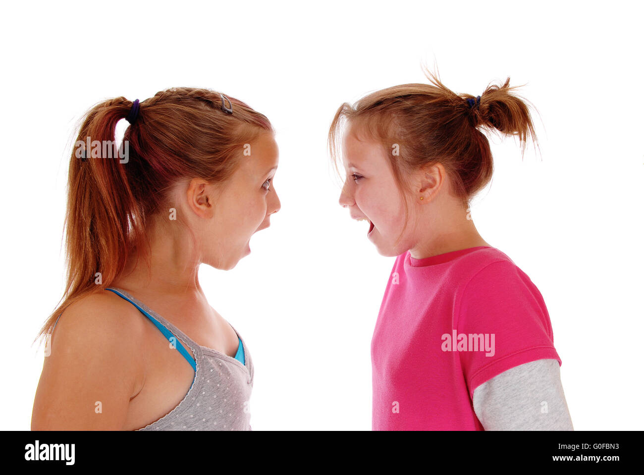 Two sisters shouting at each other. Stock Photo