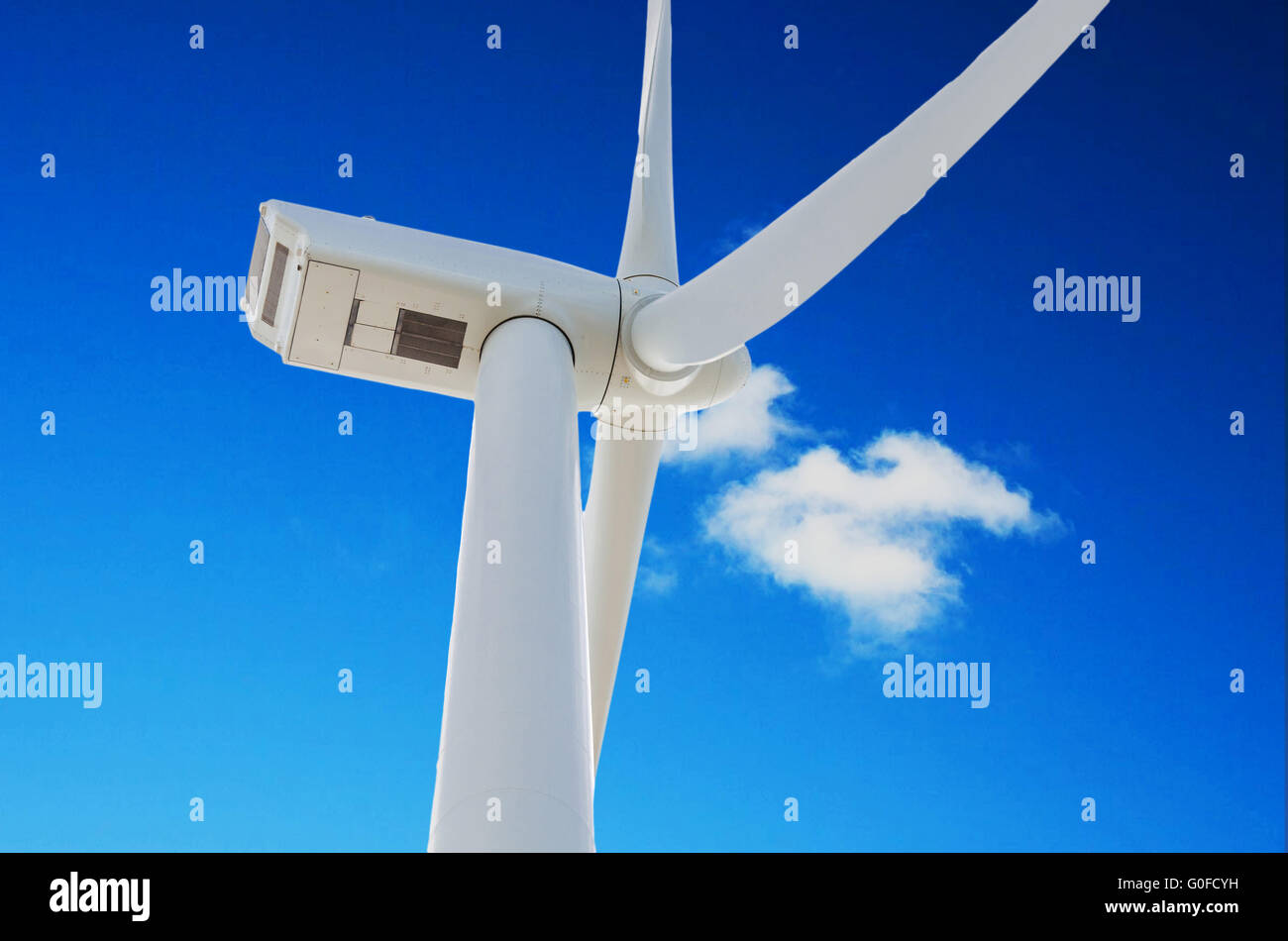 Wind turbine against a blue sky Stock Photo - Alamy