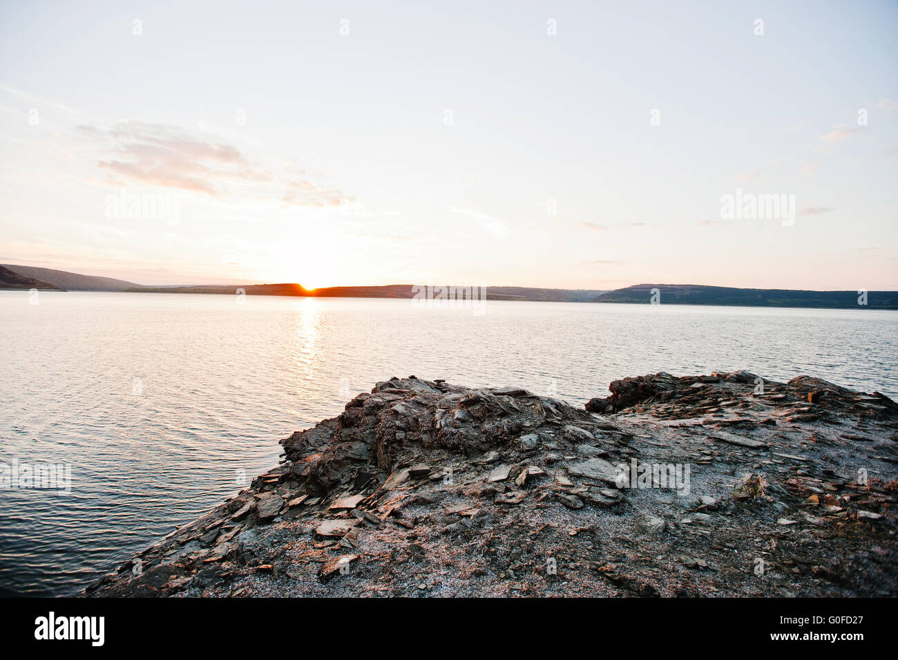 Sunset on river Dnister on reservoir Bakota, Ukraine Stock Photo