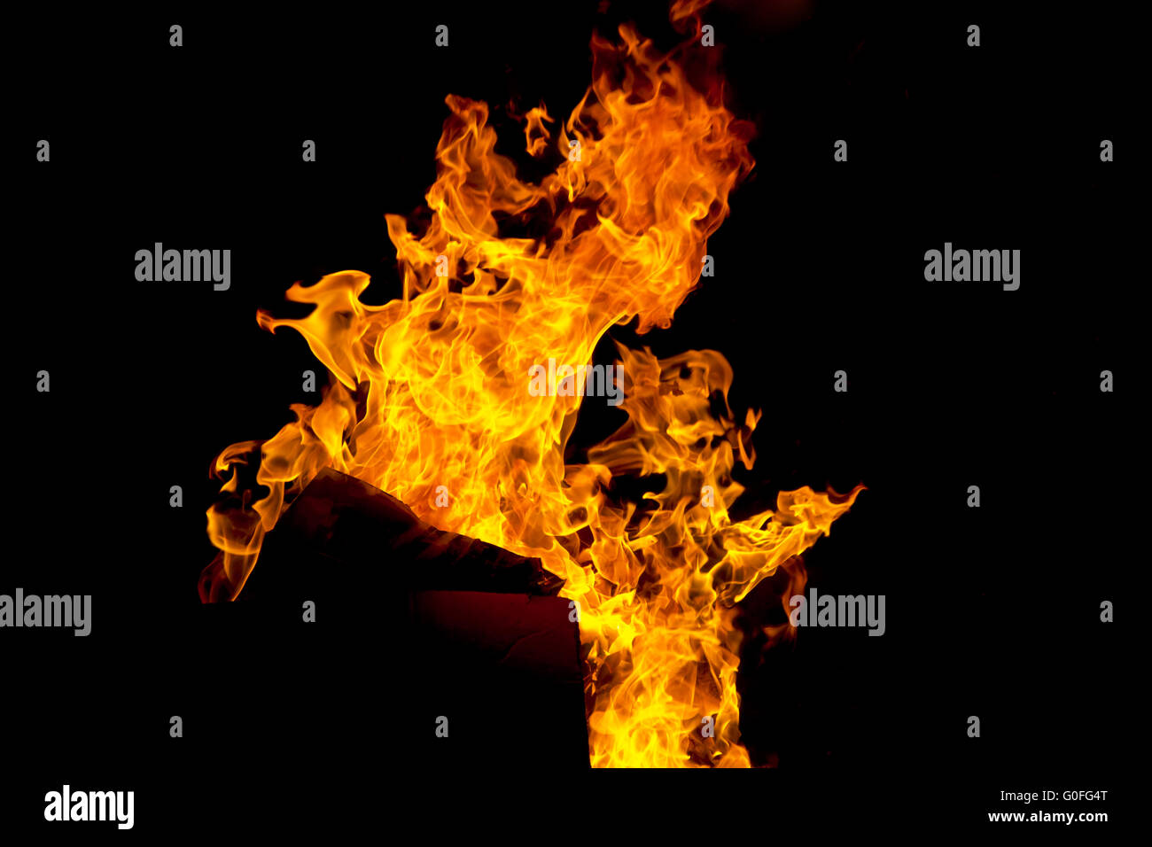 Red fire flame on black background Stock Photo - Alamy