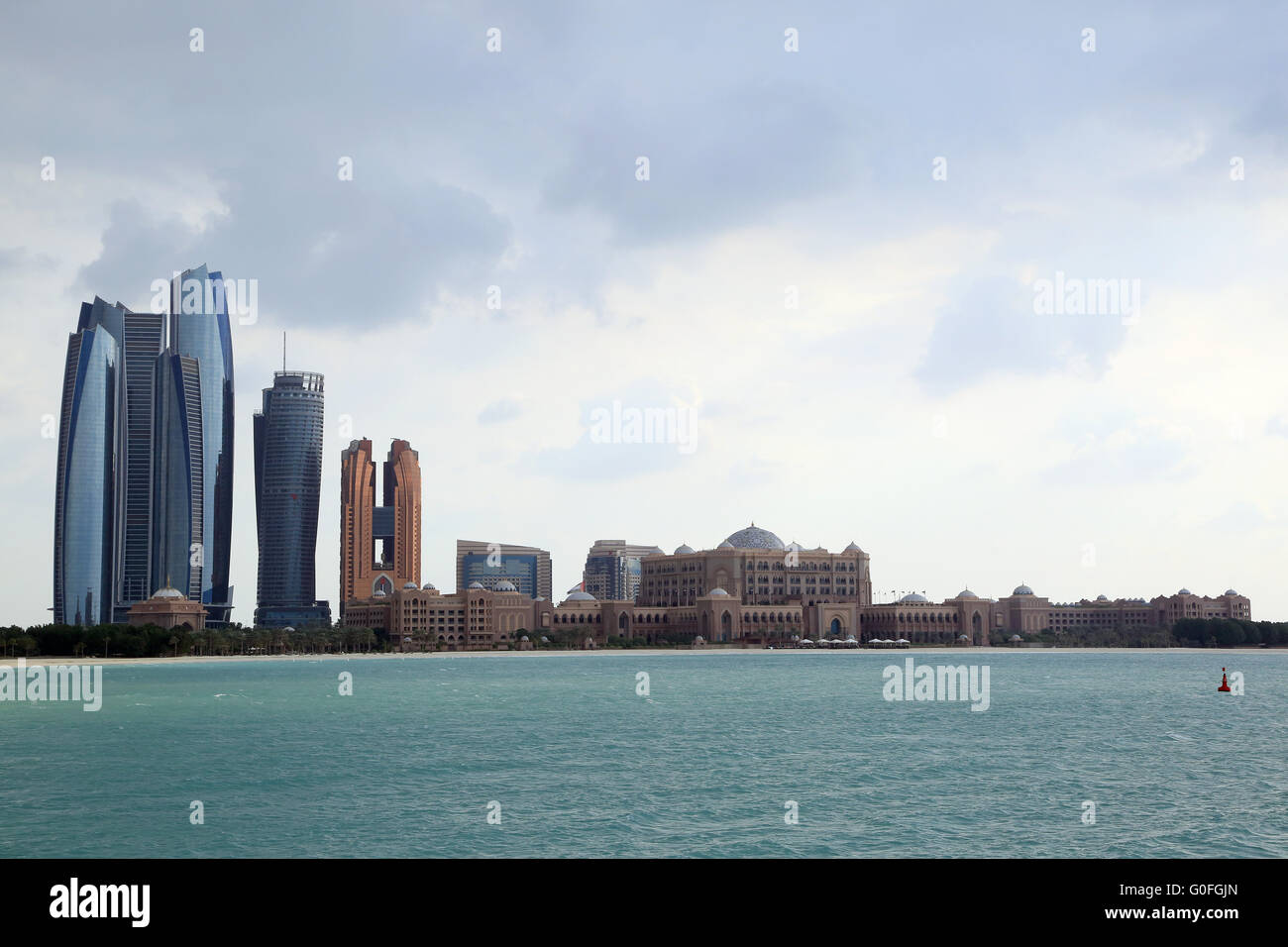 Skyline of Abu Dhabi with Ethiad Towers and the Emirates Palace Hotel Stock Photo