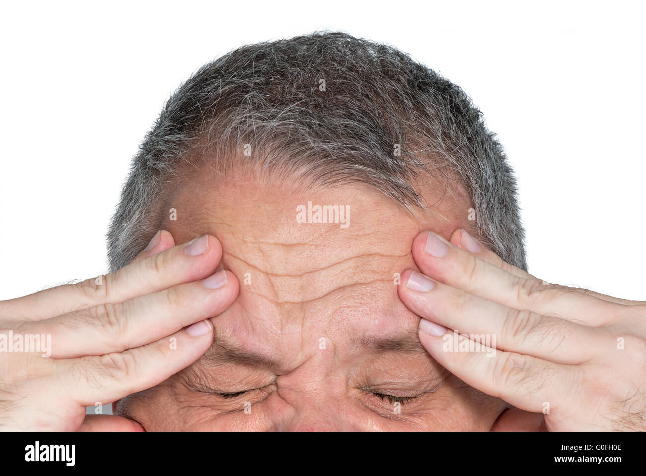 Man with hands on his forehead Stock Photo