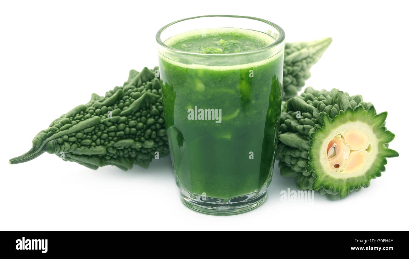 Herbal juice of green momodica over white background Stock Photo