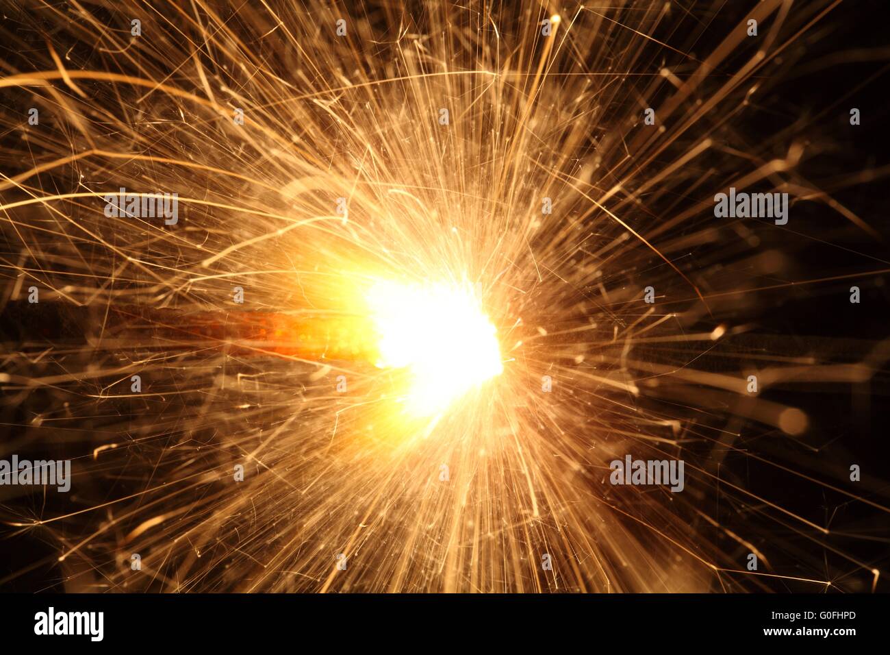 Macro photo of firework sparkler with black background. Stock Photo