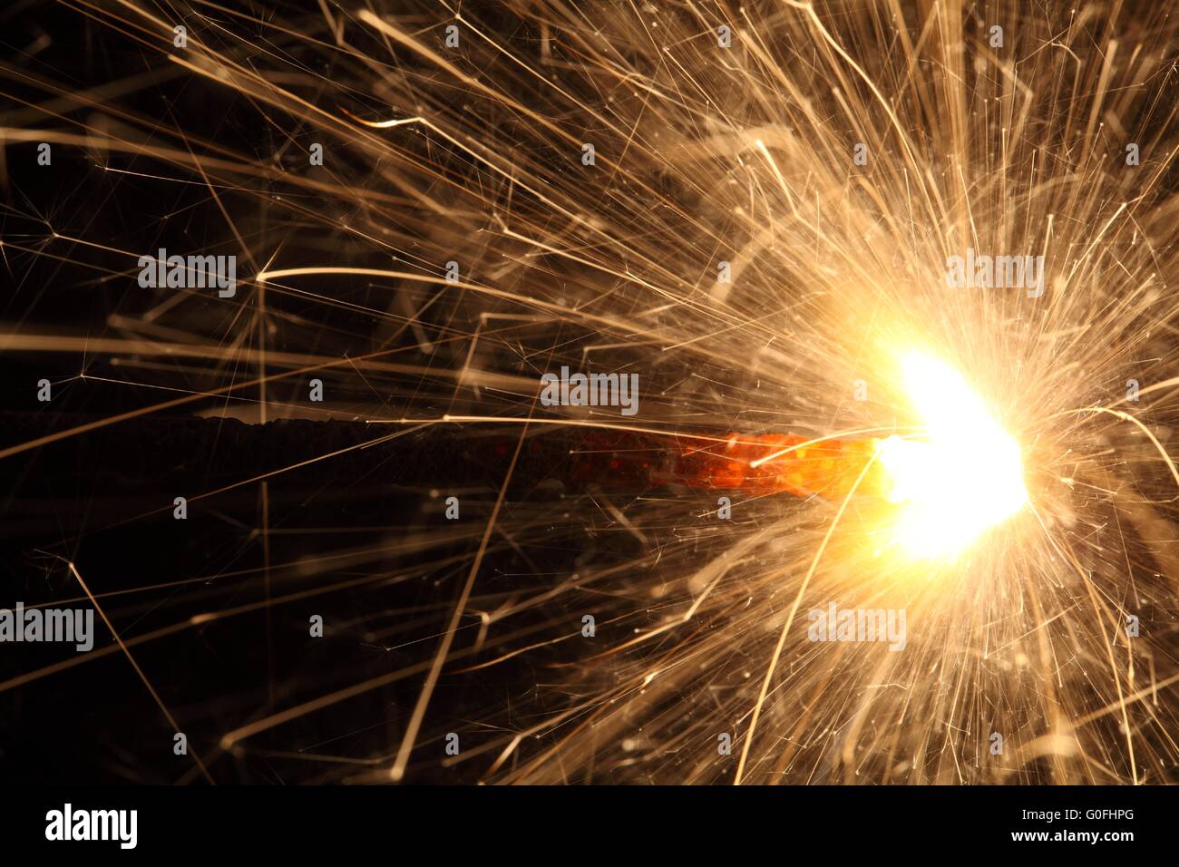 Macro photo of firework sparkler with black background. Stock Photo