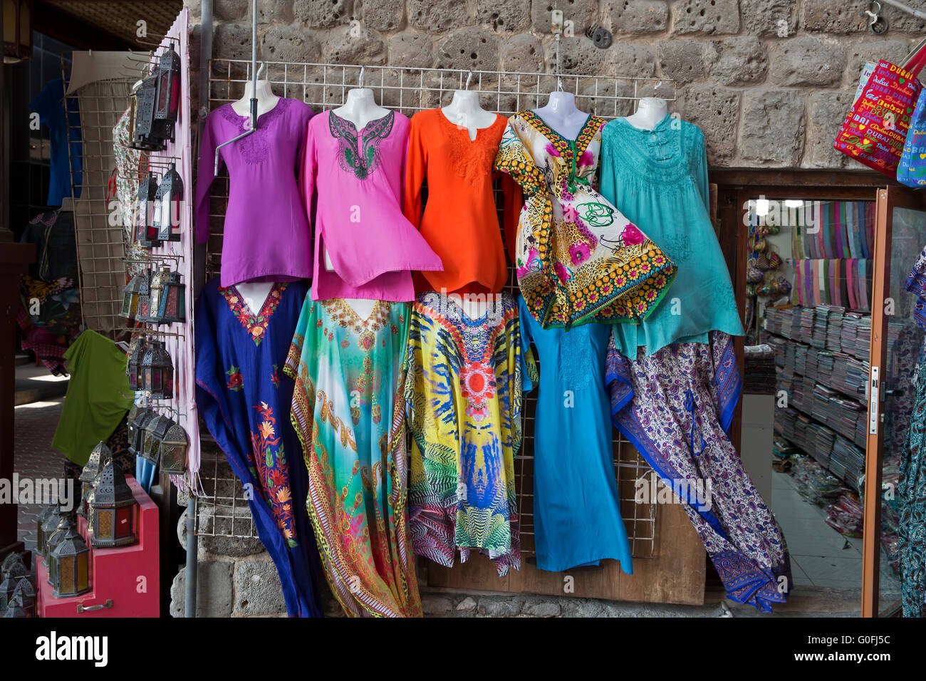 Colourful tops, dresses & trousers on sale in a market in Dubai Stock ...