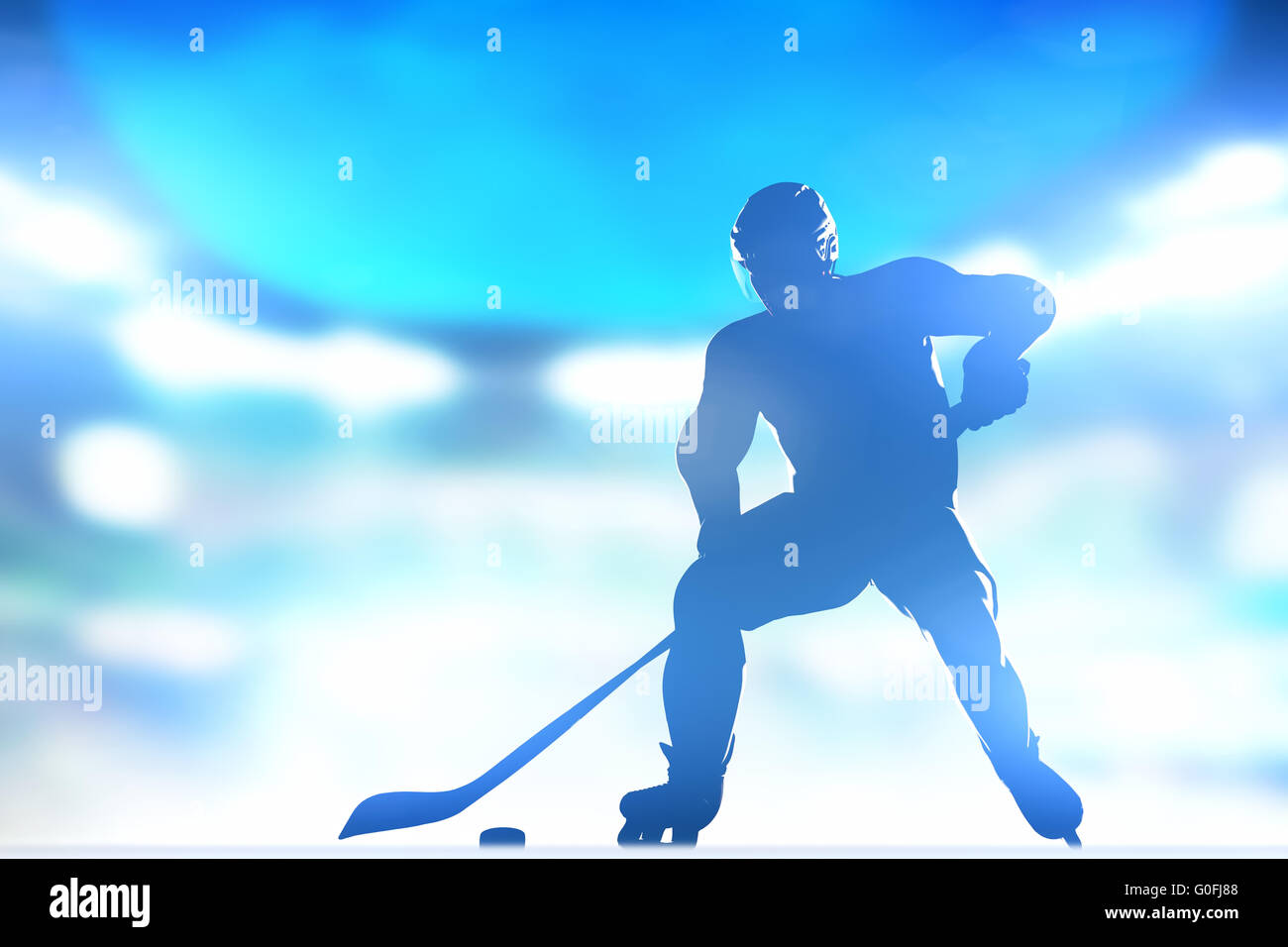 Hockey player skating with a puck. Full arena night lights Stock Photo