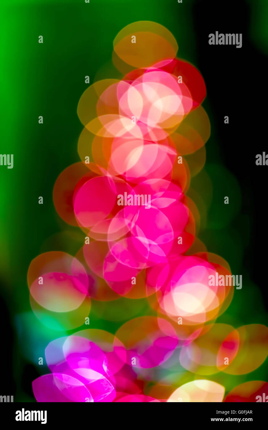Christmas tree background of true camera bokeh. Glitter and light abstract. Stock Photo