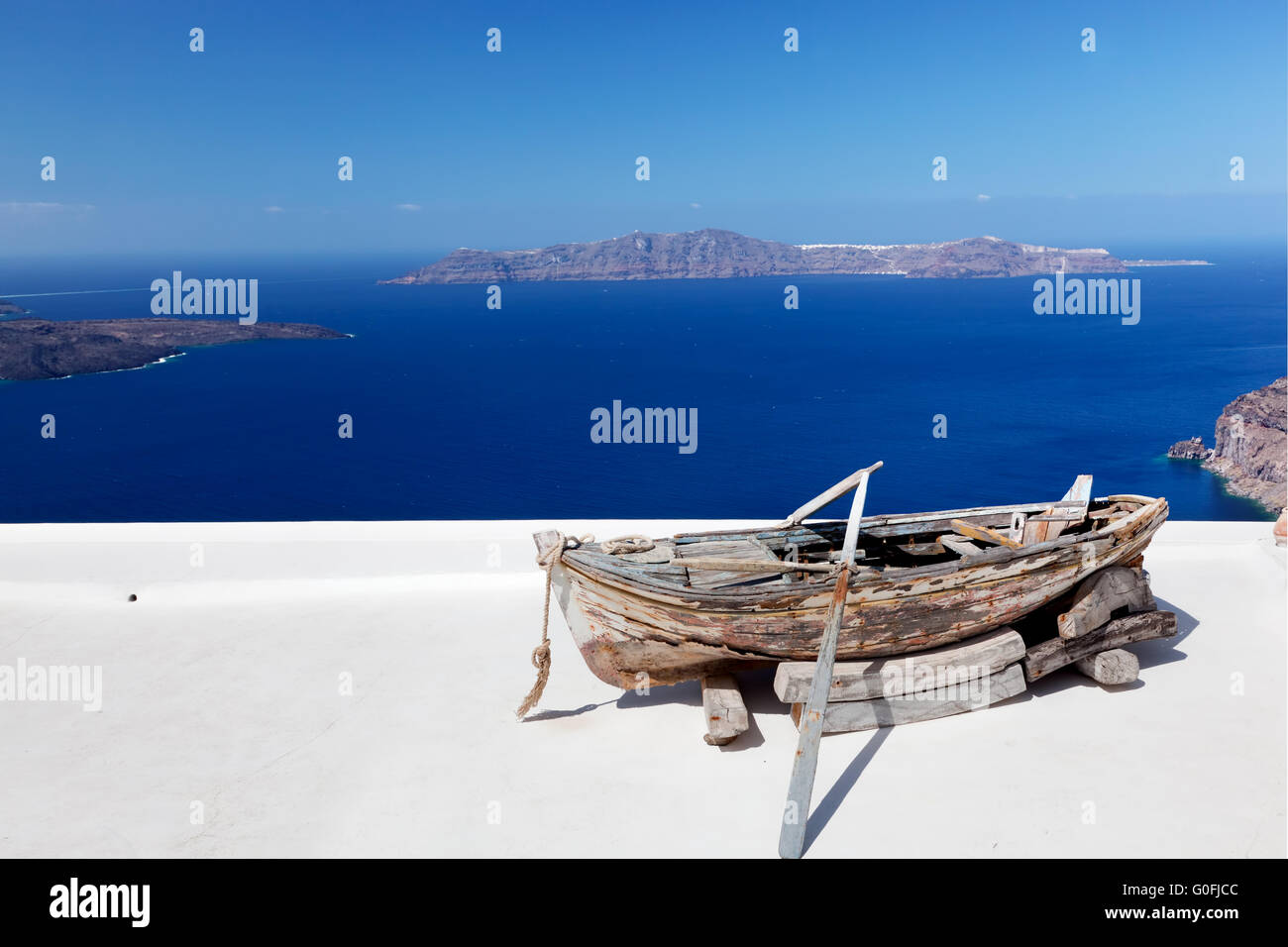 Old boat on the roof of the building on Santorini island Stock Photo ...