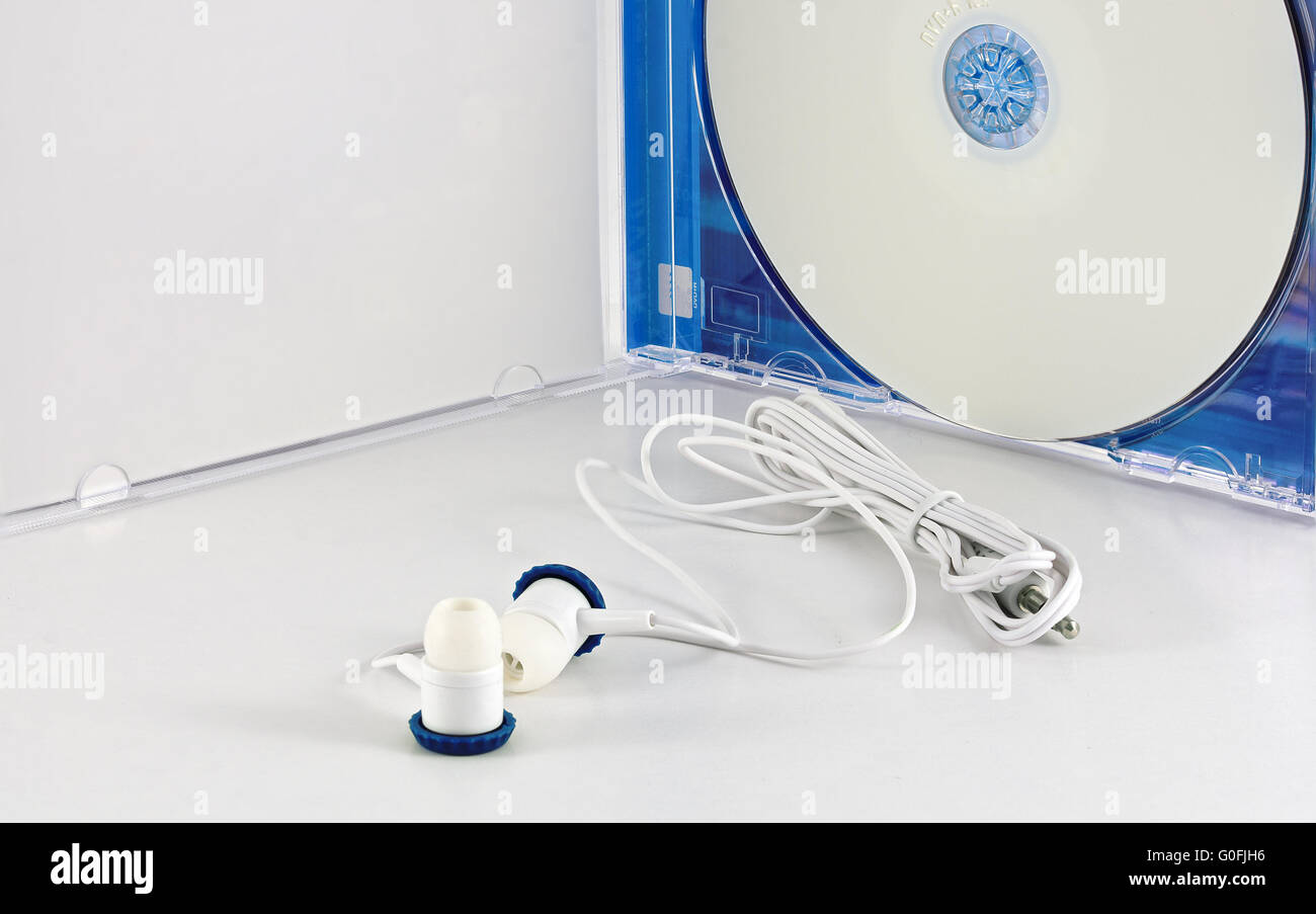 white earphones and unlabeled white blank DVD Stock Photo