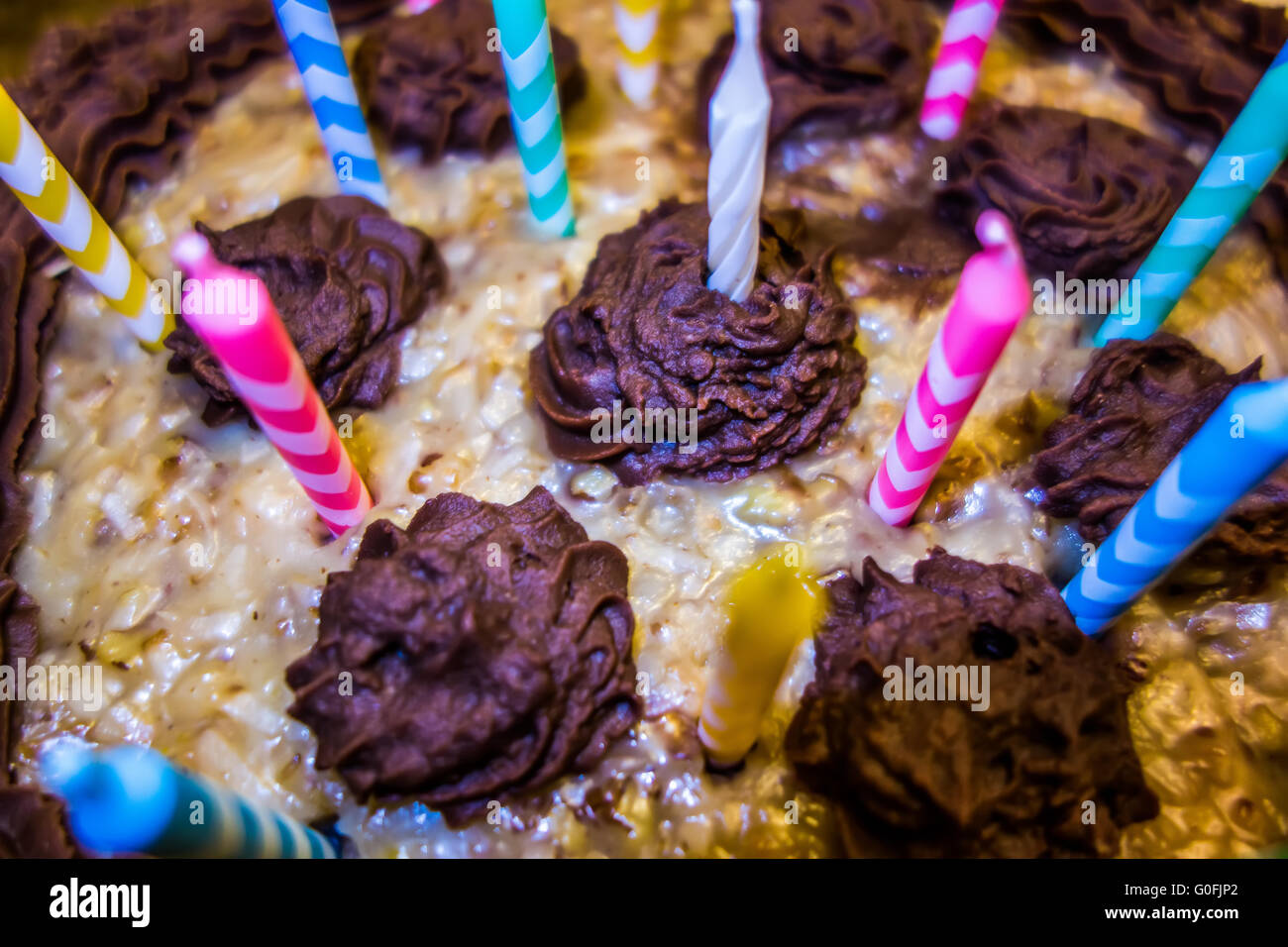lighting Colorful candles on birthday cake Stock Photo Alamy