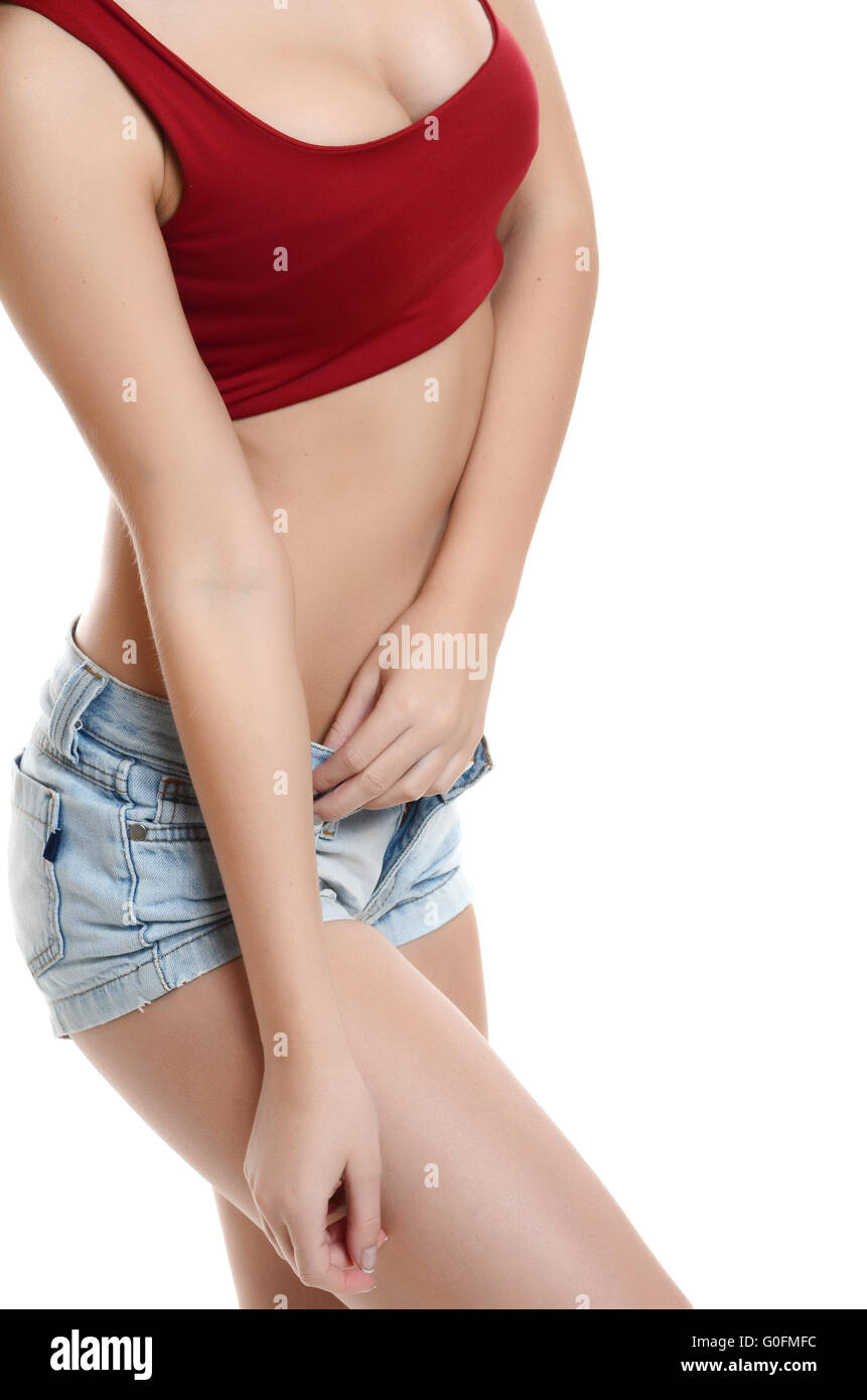 pretty blonde young woman in  Jeans shorts on white background Stock Photo