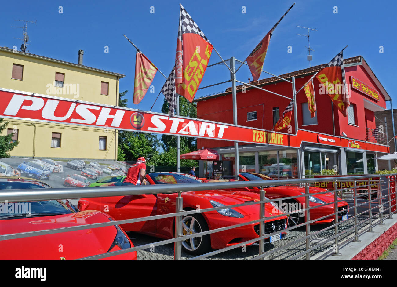 red sports cars, red house Stock Photo