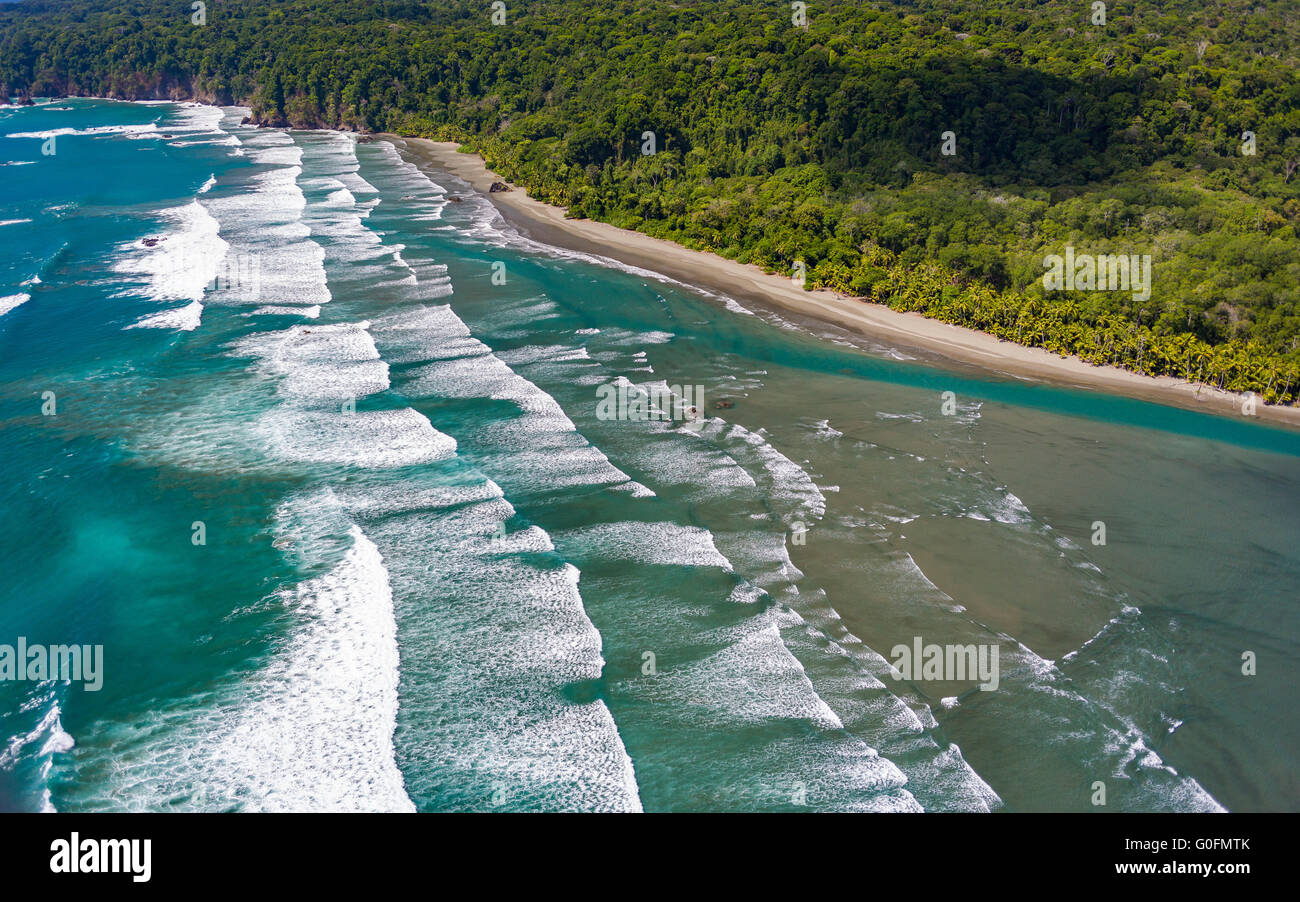 CORCOVADO NATIONAL PARK, COSTA RICA - Breaking waves, deserted beach, Pacific Ocean, Osa Peninsula rain forest. Stock Photo