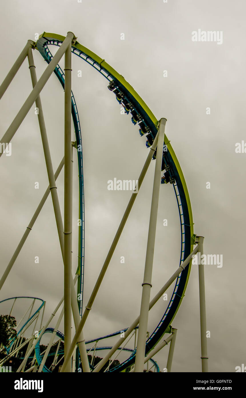 crazy rollercoaster rides at amusement park Stock Photo Alamy