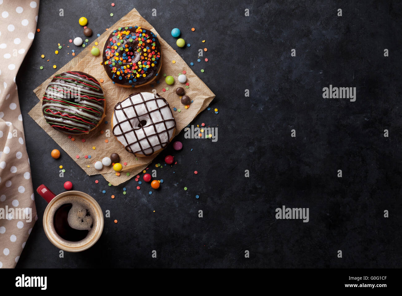 Donuts and coffee on stone table. Top view with copy space Stock Photo ...