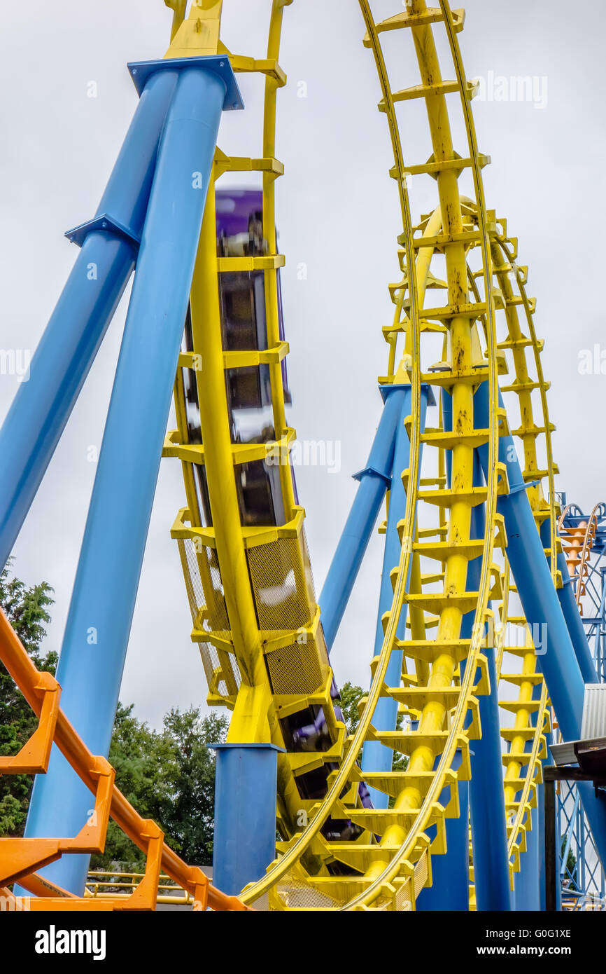 crazy rollercoaster rides at amusement park Stock Photo Alamy