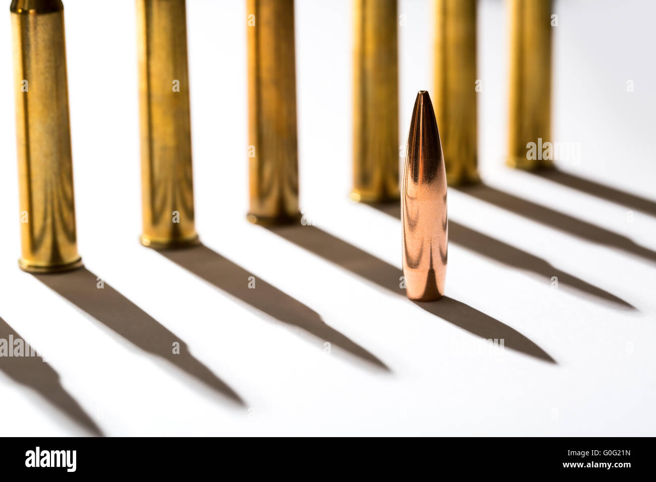 Macro shot of bullet casings on a white studio background Stock Photo