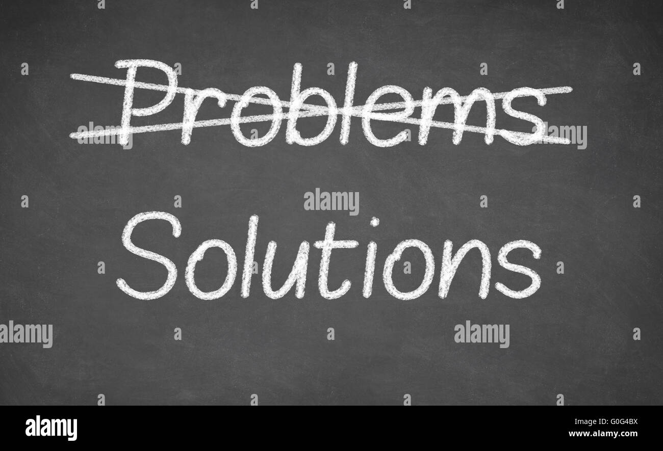 Crossing out problems and writing solutions on a blackboard Stock Photo ...