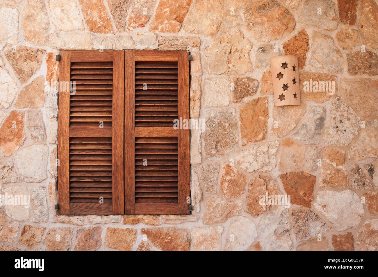 Wooden window on a stone wall Stock Photo - Alamy
