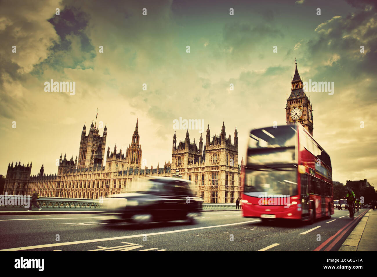London, the UK. Red bus, taxi cab in motion and Big Ben Stock Photo