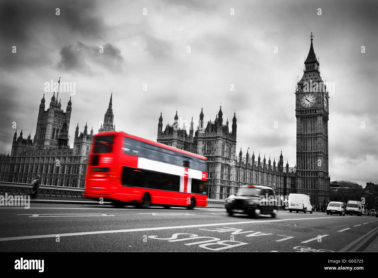 London, the UK. Red bus in motion and Big Ben Stock Photo