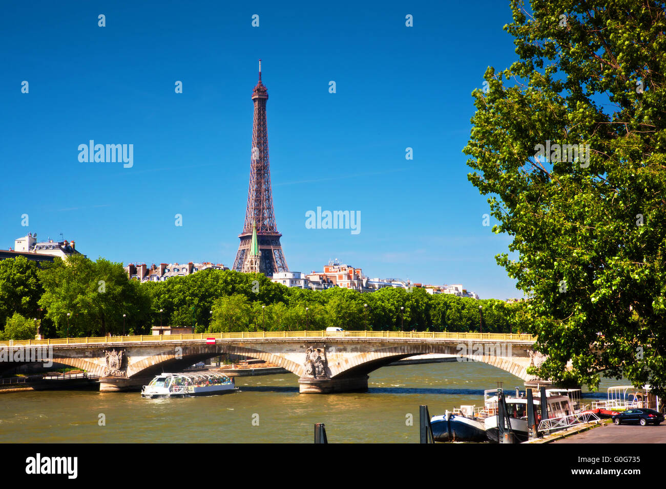 Eiffel Tower and bridge on Seine river in Paris, France. Stock Photo