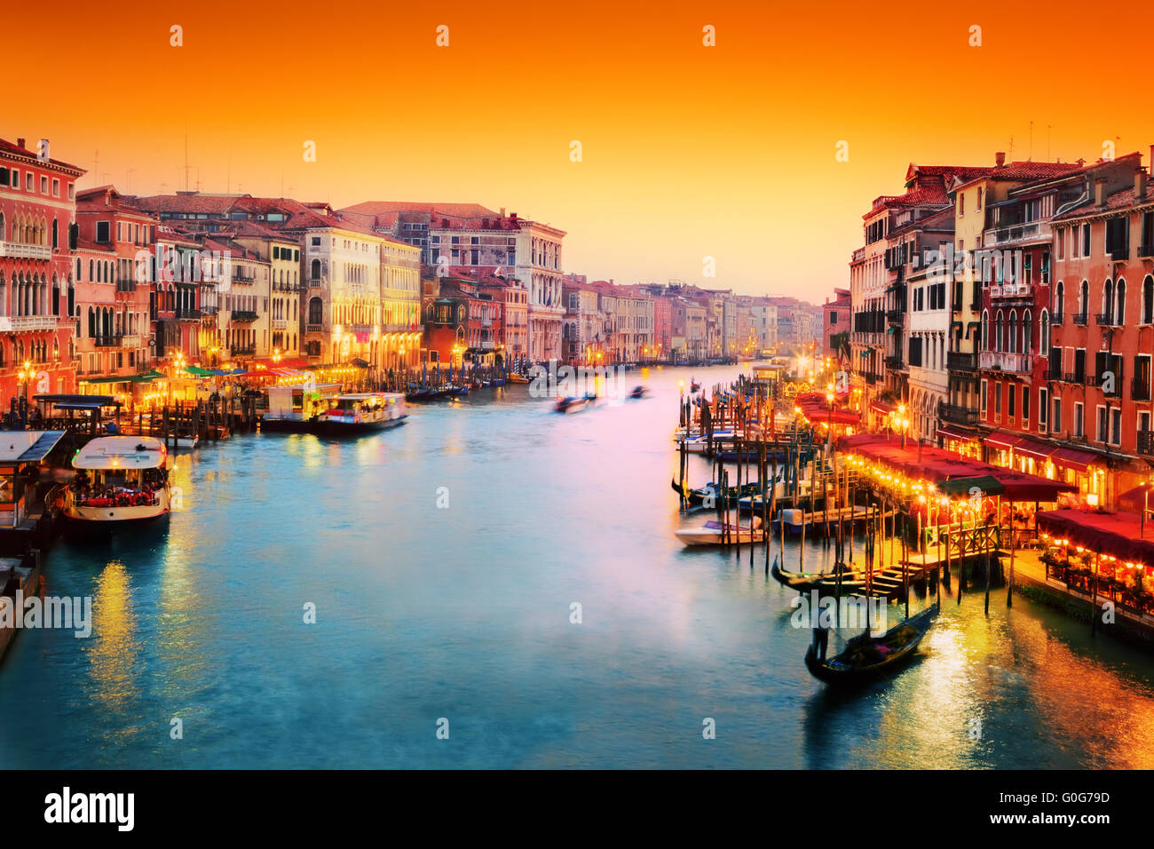 Venice, Italy. Gondola floats on Grand Canal at sunset Stock Photo