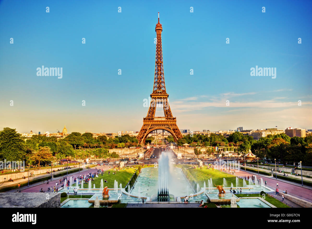 Eiffel Tower seen from fountain at Jardins du Trocadero at a sunny summer day Stock Photo