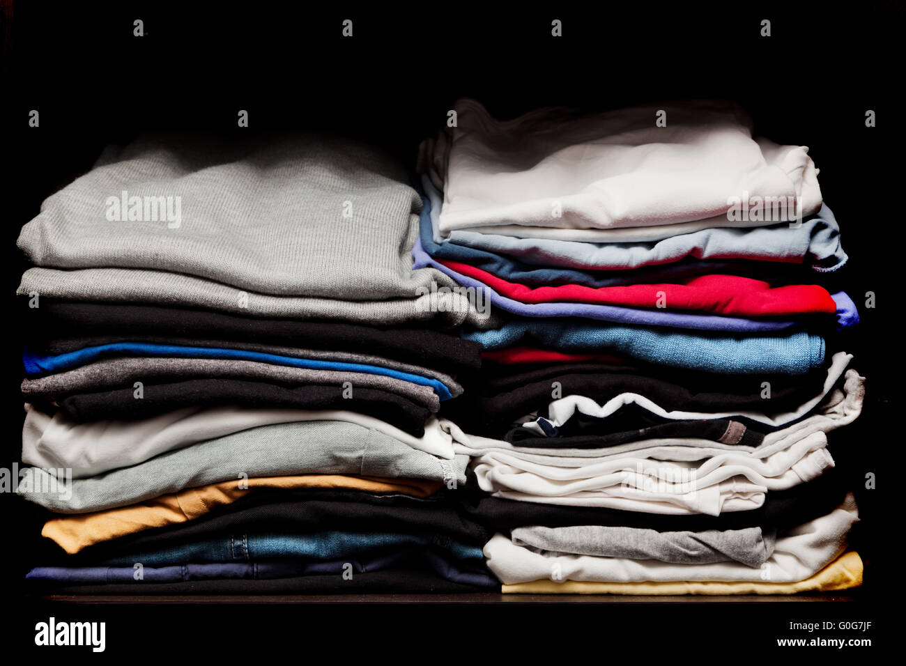 Black clothes in wardrobe hi-res stock photography and images - Alamy