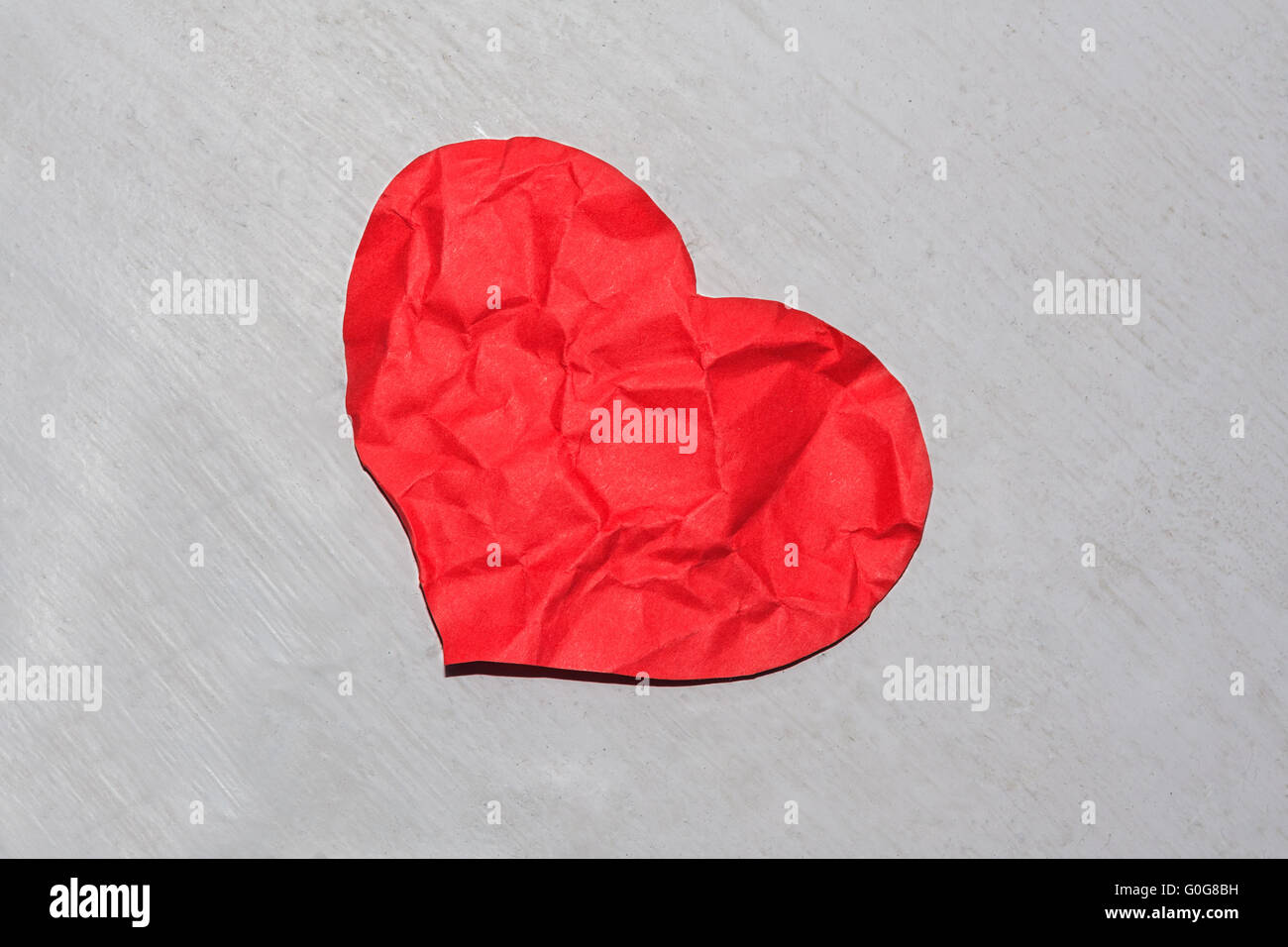 Crumpled red paper heart Stock Photo